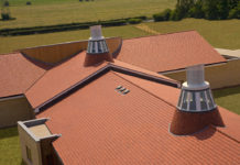 In terms of effective water drainage, a roof with a gentle slope discharges rainwater at a slower rate than a steeper roof, simply due to gravity